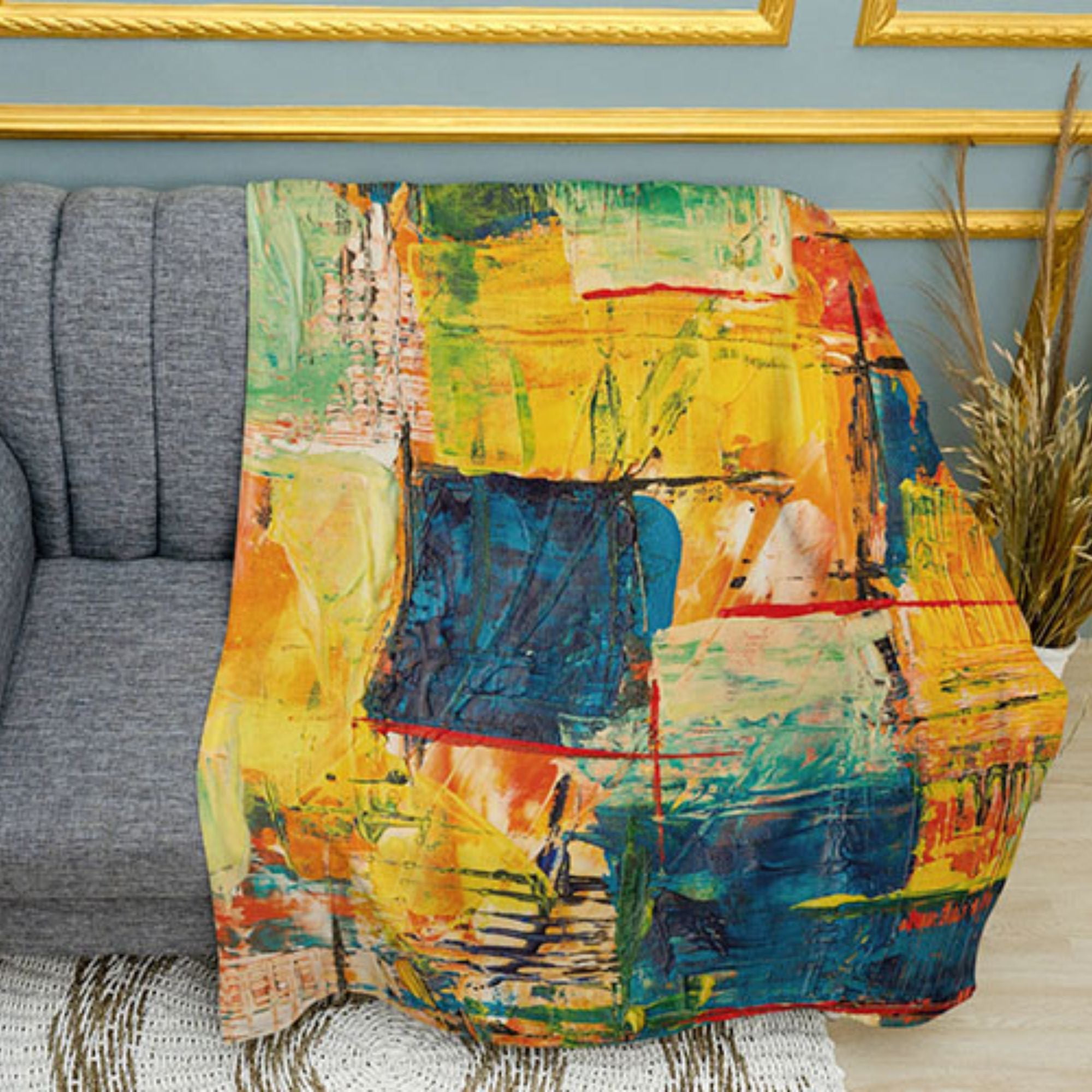 Abstract art print plush fleece throw blanket on a cozy sofa